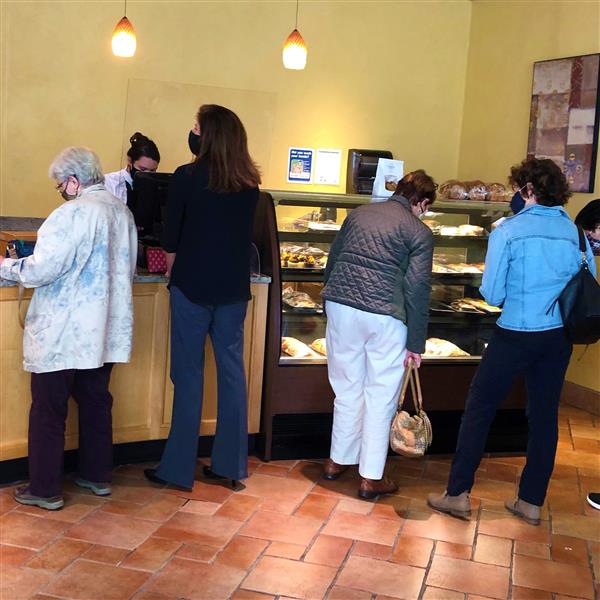Customers at the bakery counter